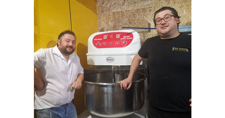 An enormous mixer helps the team keep up with demand for its delicious pizzas!