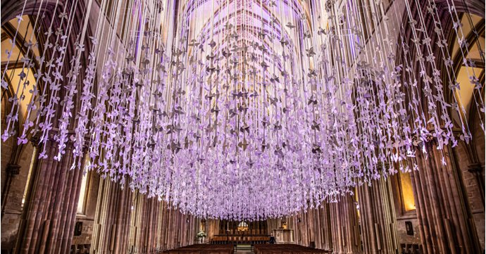 Thousands of illuminated paper doves go on display at Tewkesbury Abbey