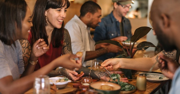Friends eating tapas at a restaurant